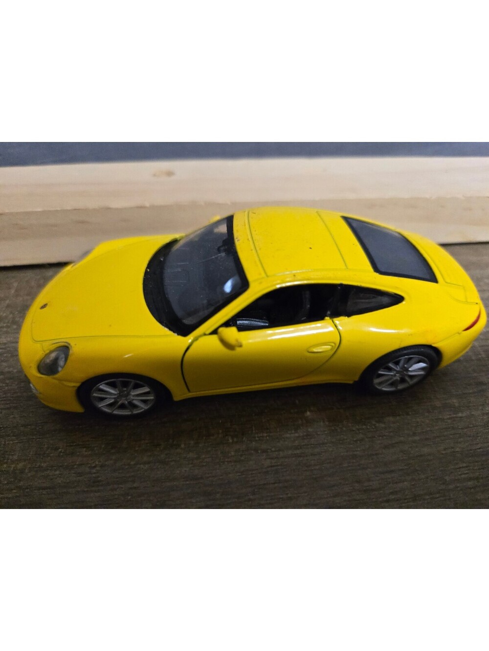 Yellow Porsche toy car
